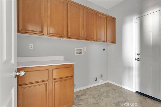 13204 Monrovia St, Hesperia, CA 92344 - washroom with gas dryer hookup, hookup for a washing machine, baseboards, electric dryer hookup, and cabinet space