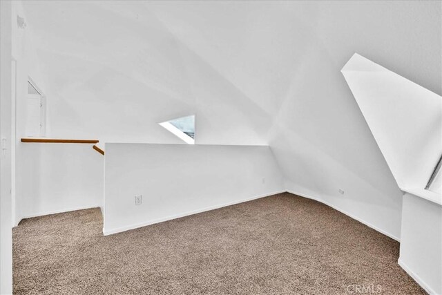 951 N Kuna Ave, Landers, CA 92285 - additional living space with carpet, lofted ceiling, a skylight, and baseboards