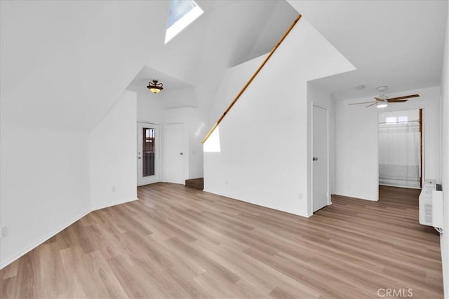 951 N Kuna Ave, Landers, CA 92285 - unfurnished living room with light wood finished floors and ceiling fan