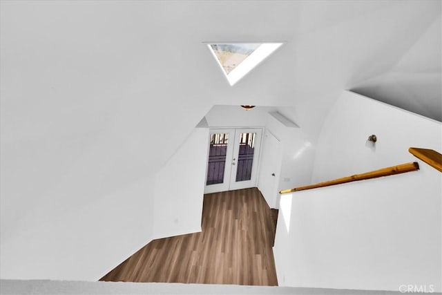 951 N Kuna Ave, Landers, CA 92285 - stairs featuring a skylight, wood finished floors, and french doors