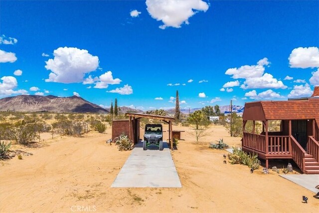 951 N Kuna Ave, Landers, CA 92285 - view of yard featuring a mountain view and a carport