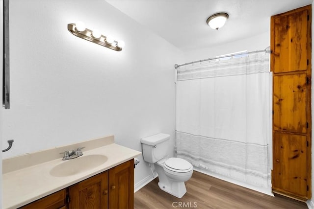 951 N Kuna Ave, Landers, CA 92285 - full bathroom with vanity, wood finished floors, and a shower with curtain