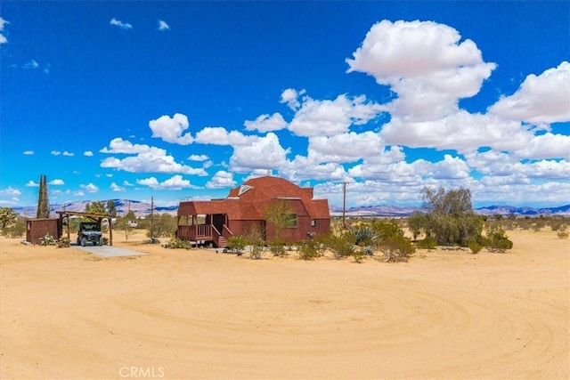 951 N Kuna Ave, Landers, CA 92285 - view of yard featuring a carport