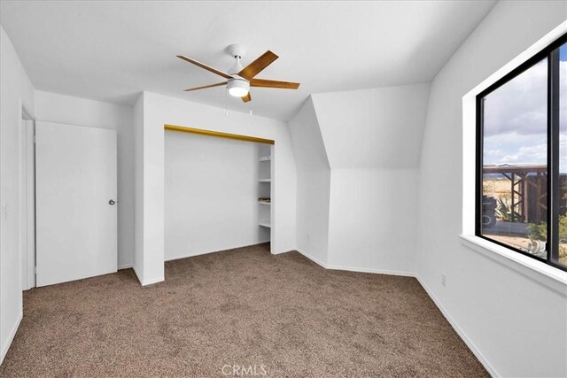 951 N Kuna Ave, Landers, CA 92285 - additional living space with a ceiling fan and carpet