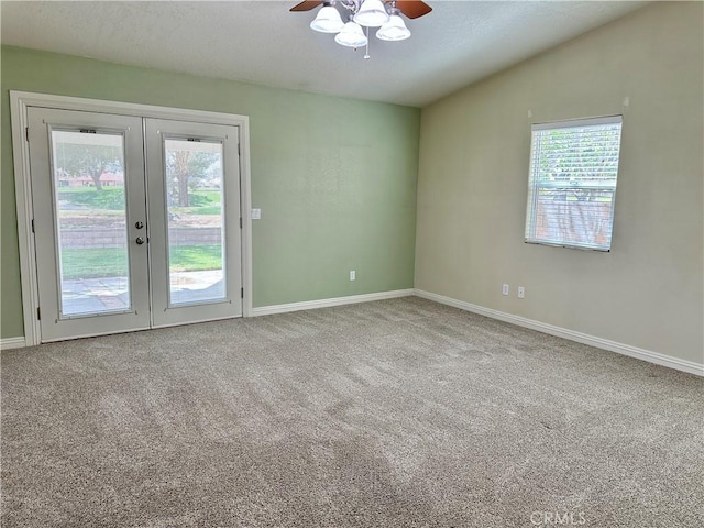 27813 Hummingbird Ln, Helendale, CA 92342 - carpeted empty room with french doors, a ceiling fan, baseboards, and vaulted ceiling