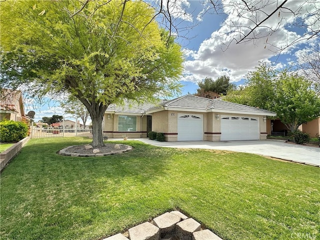27813 Hummingbird Ln, Helendale, CA 92342 - single story home with fence, an attached garage, concrete driveway, a front yard, and stucco siding