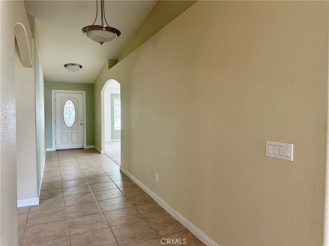 27813 Hummingbird Ln, Helendale, CA 92342 - entryway featuring light tile patterned floors, arched walkways, and baseboards