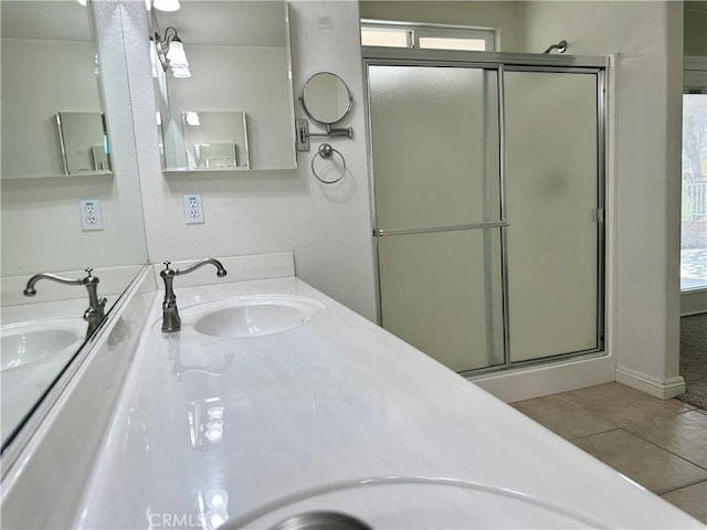 27813 Hummingbird Ln, Helendale, CA 92342 - full bathroom featuring a shower stall, tile patterned floors, double vanity, and a sink