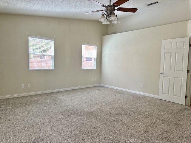 27813 Hummingbird Ln, Helendale, CA 92342 - spare room featuring a textured ceiling, visible vents, ceiling fan, and carpet