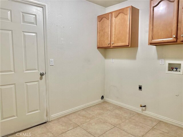 27813 Hummingbird Ln, Helendale, CA 92342 - laundry room featuring gas dryer hookup, washer hookup, baseboards, electric dryer hookup, and cabinet space