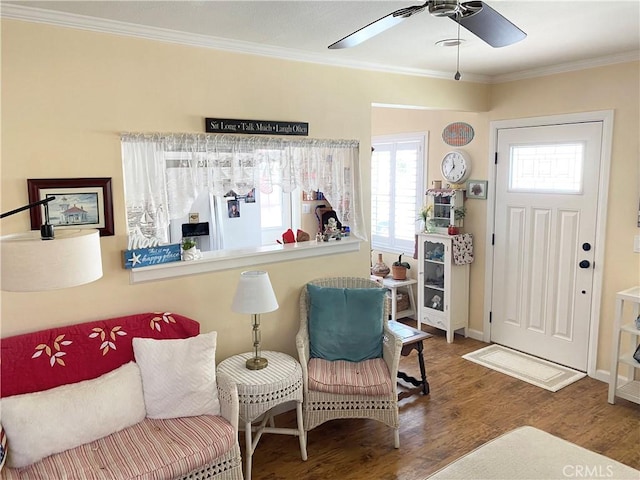 258 17th St, Seal Beach, CA 90740 - entrance foyer featuring wood finished floors, baseboards, ornamental molding, and ceiling fan