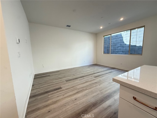 15903 Blue Copper Way, Fontana, CA 92336 - empty room with light wood finished floors, baseboards, and recessed lighting