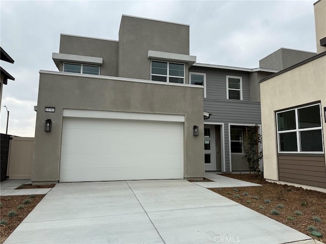 15742 Caterpillar Dr, Fontana, CA 92336 - modern home featuring driveway and stucco siding