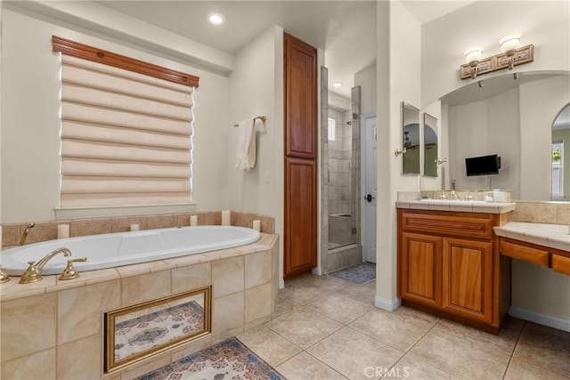 1403 Sonora St, San Bernardino, CA 92404 - full bathroom featuring a bath, vanity, tile patterned floors, and a shower stall