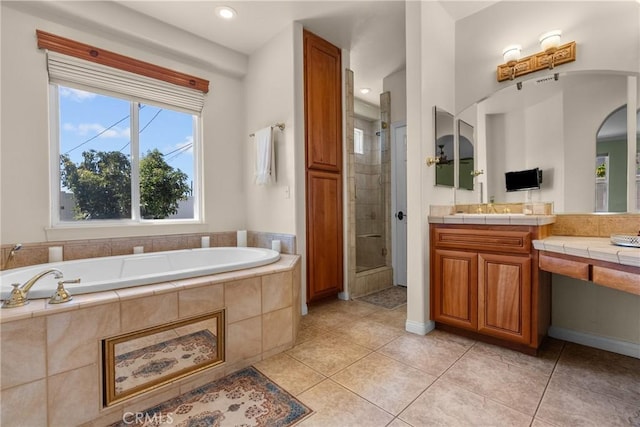 1403 Sonora St, San Bernardino, CA 92404 - bathroom with a bath, tile patterned floors, recessed lighting, vanity, and a stall shower