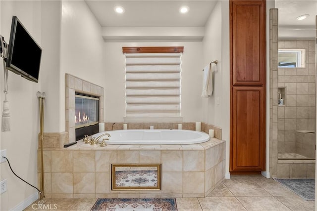 1403 Sonora St, San Bernardino, CA 92404 - bathroom featuring tile patterned floors, a tile shower, and a garden tub