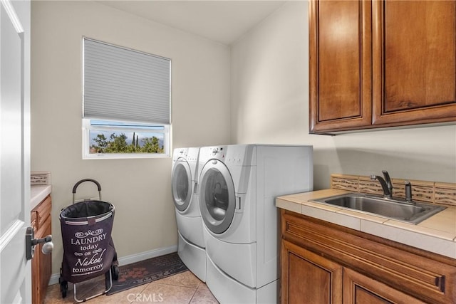 1403 Sonora St, San Bernardino, CA 92404 - laundry area with a sink, separate washer and dryer, light tile patterned floors, baseboards, and cabinet space