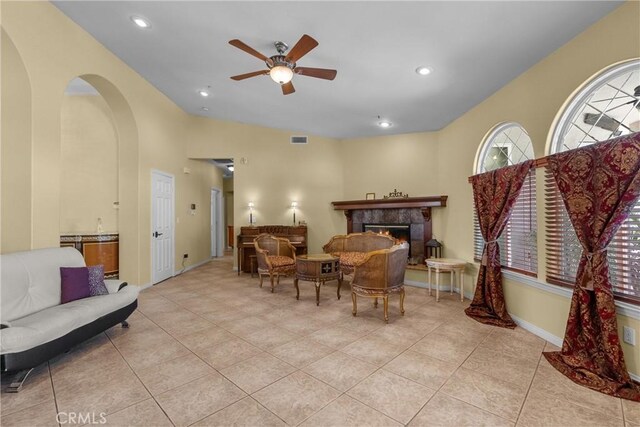 1403 Sonora St, San Bernardino, CA 92404 - sitting room with ceiling fan, visible vents, a tiled fireplace, and light tile patterned floors