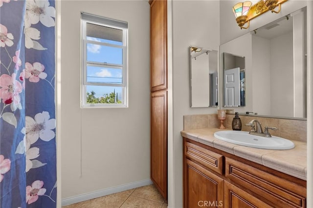 1403 Sonora St, San Bernardino, CA 92404 - full bath featuring a shower with curtain, vanity, baseboards, tile patterned floors, and visible vents