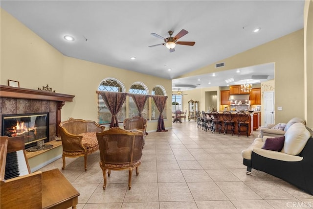 1403 Sonora St, San Bernardino, CA 92404 - living area with visible vents, a fireplace, lofted ceiling, ceiling fan with notable chandelier, and light tile patterned floors