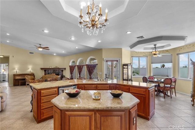 1403 Sonora St, San Bernardino, CA 92404 - kitchen featuring ceiling fan with notable chandelier, open floor plan, a spacious island, and dishwasher
