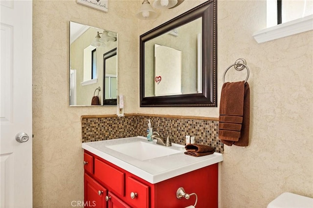 bathroom featuring toilet and vanity