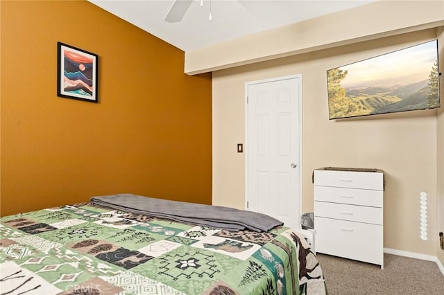 bedroom featuring baseboards, lofted ceiling, ceiling fan, and carpet