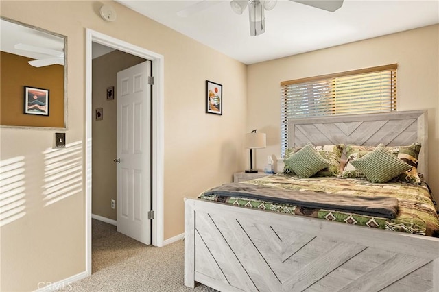 carpeted bedroom with baseboards and a ceiling fan