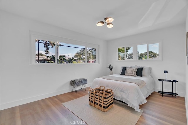 10525 S 5th Ave, Inglewood, CA 90303 - bedroom featuring baseboards and wood finished floors