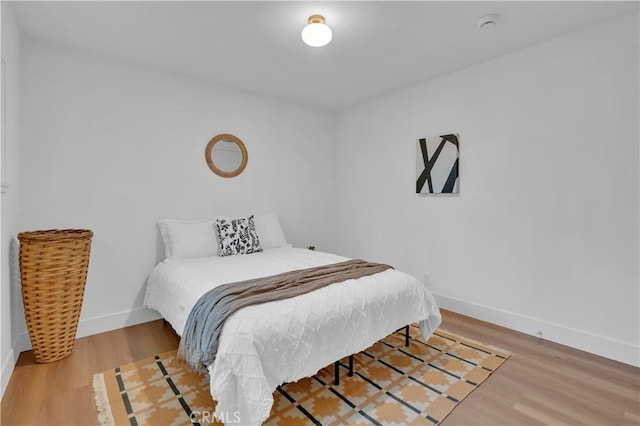 10525 S 5th Ave, Inglewood, CA 90303 - bedroom featuring baseboards and wood finished floors