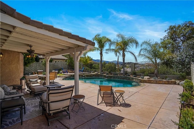 view of swimming pool featuring a fenced in pool, a patio area, a fenced backyard, and a mountain view