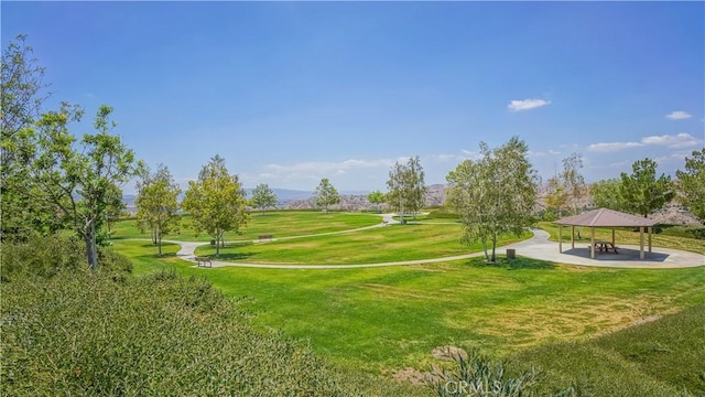 surrounding community with a yard and a gazebo