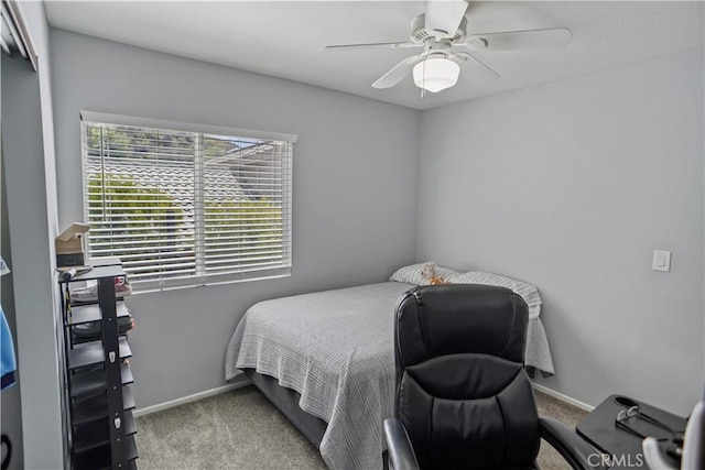 bedroom featuring ceiling fan, baseboards, and carpet floors