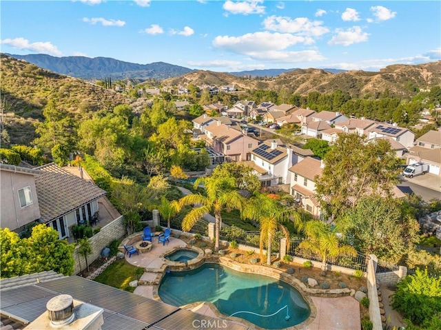 drone / aerial view with a mountain view and a residential view