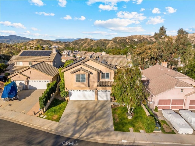 bird's eye view with a residential view and a mountain view