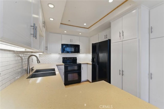 8292 Manifesto Cir, Huntington Beach, CA 92646 - kitchen with tasteful backsplash, a sink, light countertops, a tray ceiling, and black appliances