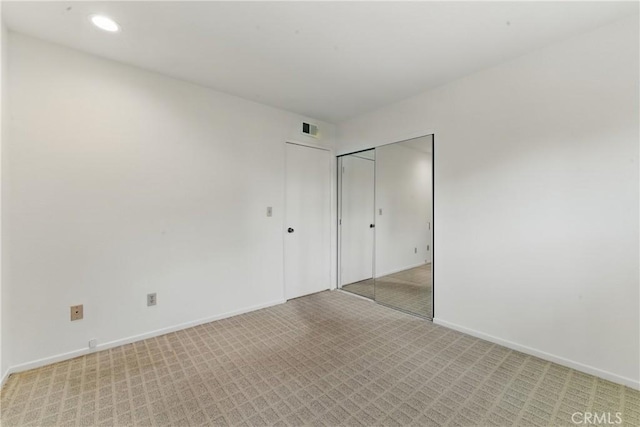 8292 Manifesto Cir, Huntington Beach, CA 92646 - unfurnished bedroom featuring light carpet, baseboards, visible vents, and recessed lighting