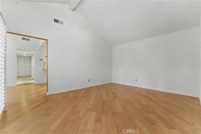 8292 Manifesto Cir, Huntington Beach, CA 92646 - spare room featuring high vaulted ceiling, visible vents, light wood finished floors, baseboards, and beam ceiling