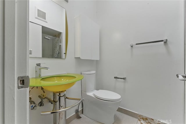 8292 Manifesto Cir, Huntington Beach, CA 92646 - full bathroom with visible vents, baseboards, a sink, and toilet