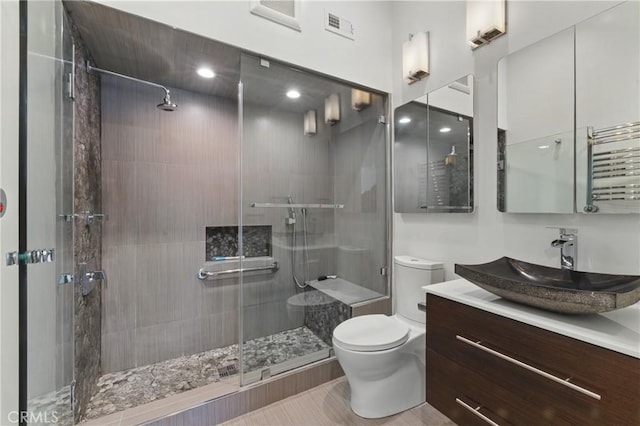 8292 Manifesto Cir, Huntington Beach, CA 92646 - full bathroom featuring visible vents, toilet, radiator, vanity, and a stall shower