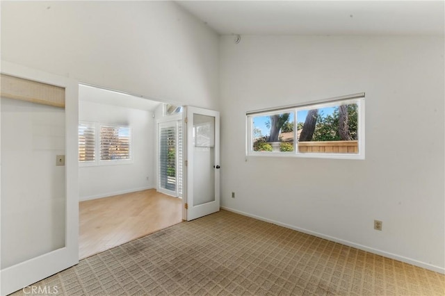 8292 Manifesto Cir, Huntington Beach, CA 92646 - unfurnished room with high vaulted ceiling, baseboards, and a wealth of natural light