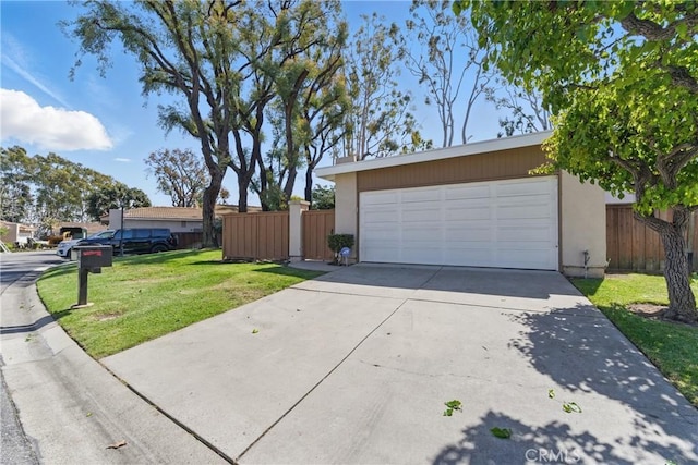 8292 Manifesto Cir, Huntington Beach, CA 92646 - view of front of property featuring concrete driveway, stucco siding, an attached garage, a front yard, and fence