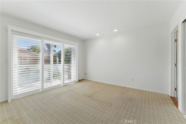 8292 Manifesto Cir, Huntington Beach, CA 92646 - spare room with baseboards, recessed lighting, and light carpet