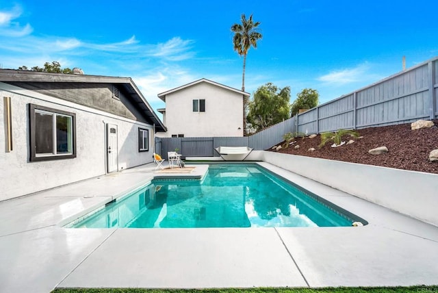 view of pool featuring a fenced backyard, a patio, and a fenced in pool