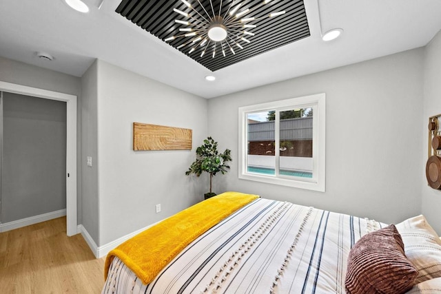 bedroom with light wood-style floors, baseboards, visible vents, and recessed lighting