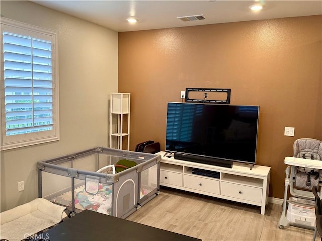 interior space featuring wood finished floors, visible vents, and recessed lighting