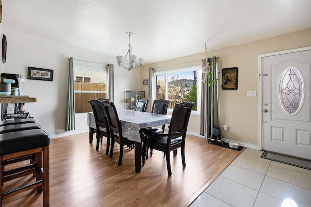 804 S 37th St, San Diego, CA 92113 - dining room with a chandelier, wood finished floors, and baseboards