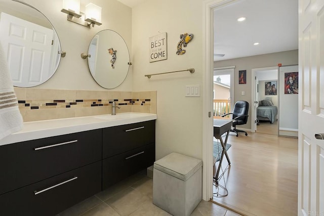 804 S 37th St, San Diego, CA 92113 - bathroom with backsplash, vanity, wood finished floors, and recessed lighting