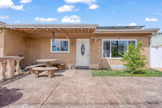 804 S 37th St, San Diego, CA 92113 - property entrance with stucco siding and a patio area