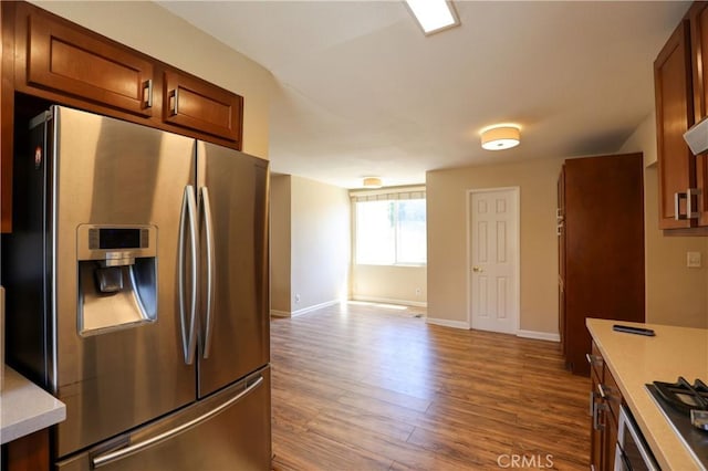 3477 Avenida Simi, Simi Valley, CA 93063 - kitchen with wood finished floors, stainless steel fridge with ice dispenser, light countertops, and baseboards